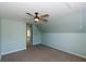 Bedroom features a ceiling fan and a window providing natural light at 3641 Willow Club Dr, Loganville, GA 30052