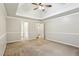 Spacious bedroom boasts plush carpeting, tray ceiling, and neutral paint at 3641 Willow Club Dr, Loganville, GA 30052