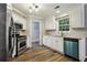 Kitchen with white cabinets, stainless steel appliances and stone countertops at 3641 Willow Club Dr, Loganville, GA 30052