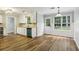 Bright kitchen with white cabinets, granite countertops, and stainless steel appliances at 3641 Willow Club Dr, Loganville, GA 30052