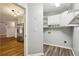 Bright Laundry area features built in white cabinets and shelving units at 3641 Willow Club Dr, Loganville, GA 30052