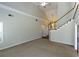 Spacious living room with vaulted ceiling, ceiling fan and view to the 2nd story landing at 3641 Willow Club Dr, Loganville, GA 30052