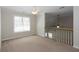 Cozy loft area with neutral carpeting and natural light at 3641 Willow Club Dr, Loganville, GA 30052