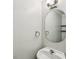 This powder room features a mirror and mounted towel rings at 3641 Willow Club Dr, Loganville, GA 30052