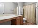 Bathroom with full tub and shower and large vanity at 5152 Rapahoe Trl, Atlanta, GA 30349