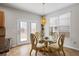 Cozy dining area with an elegant glass-top table and four chairs at 5152 Rapahoe Trl, Atlanta, GA 30349