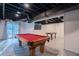 Finished basement features a recreational area with a pool table and access to the backyard at 1744 Millview Dr, Marietta, GA 30062