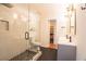 Stylish bathroom with glass shower, gray cabinets, and hexagon floor tiles at 1744 Millview Dr, Marietta, GA 30062