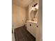 Small bathroom with a round mirror and modern vanity at 1744 Millview Dr, Marietta, GA 30062