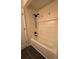 Bathroom with a tub and shower featuring white subway tile at 1744 Millview Dr, Marietta, GA 30062