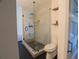Bathroom featuring a glass-enclosed shower with subway tile and hexagon mosaic floor at 1744 Millview Dr, Marietta, GA 30062