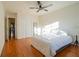 Bright bedroom boasts wood floors, a ceiling fan, a closet, and natural light at 1744 Millview Dr, Marietta, GA 30062