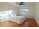 Bright bedroom features hardwood floors, natural light, a ceiling fan, and neutral walls at 1744 Millview Dr, Marietta, GA 30062