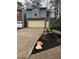 Charming two-story home with a brick-accented garage and newly installed black mulch at 1744 Millview Dr, Marietta, GA 30062