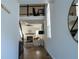 Bright hallway with hardwood floors, a modern staircase, and views into the living room and an upper floor office space at 1744 Millview Dr, Marietta, GA 30062