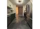 Galley kitchen with stainless steel appliances, updated cabinets, and modern backsplash with an open design at 1744 Millview Dr, Marietta, GA 30062