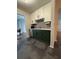 Galley kitchen with stainless steel appliances, updated two-tone cabinets, and modern backsplash at 1744 Millview Dr, Marietta, GA 30062