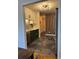 Galley kitchen with stainless steel appliances, updated two-tone cabinets, and modern backsplash and flooring at 1744 Millview Dr, Marietta, GA 30062