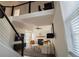 Open concept living room boasts hardwood floors, fireplace, and a loft at 1744 Millview Dr, Marietta, GA 30062