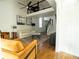 Stylish living room has vaulted ceiling, a fireplace, and open staircase at 1744 Millview Dr, Marietta, GA 30062