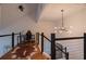 Loft space with a desk, chair, and modern light fixture at 1744 Millview Dr, Marietta, GA 30062