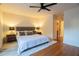 Spacious main bedroom with wood floors, large bed, and modern lighting at 1744 Millview Dr, Marietta, GA 30062