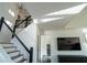 Modern staircase with black railings, wood treads, and lots of light at 1744 Millview Dr, Marietta, GA 30062