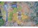 An aerial view of the house and the surrounding neighborhood, with mature trees and landscaping at 2270 Old Concord Se Dr, Covington, GA 30016