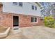 Backyard patio area featuring brick exterior, yard, and an entrance to the interior at 2270 Old Concord Se Dr, Covington, GA 30016