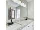 Bright bathroom featuring a dual sink vanity, granite countertops, and modern fixtures at 2270 Old Concord Se Dr, Covington, GA 30016