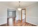 Elegant dining area with beautiful wood floors and a view into the Gathering room at 2270 Old Concord Se Dr, Covington, GA 30016