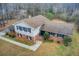 Charming home showcasing a brick facade, blue shutters, and a well-manicured front yard at 2270 Old Concord Se Dr, Covington, GA 30016