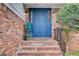 Charming brick home with a vibrant blue front door and well-maintained landscaping at 2270 Old Concord Se Dr, Covington, GA 30016