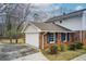 Attached garage with a white door and blue shutters, offering convenient parking and storage at 2270 Old Concord Se Dr, Covington, GA 30016