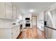 Well-lit kitchen with stainless steel appliances, updated countertops, and ample cabinet space at 2270 Old Concord Se Dr, Covington, GA 30016