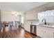 Bright, open kitchen with stainless appliances and dining nook overlooking the cozy fireplace at 2270 Old Concord Se Dr, Covington, GA 30016