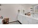 Bathroom featuring double sinks, white cabinets, and a large mirror at 1241 Skylar Ridge Cir, Buford, GA 30519