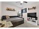 Bedroom showcasing a daybed, a flag wall decoration, and a wooden table at 1241 Skylar Ridge Cir, Buford, GA 30519