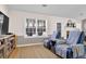 Inviting living room featuring comfortable seating, neutral walls, and bright natural light at 1241 Skylar Ridge Cir, Buford, GA 30519