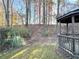 Charming gazebo nestled in a serene, wooded backyard, providing a peaceful retreat at 396 Avian Forest Dr, Stockbridge, GA 30281