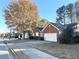 A charming street view showcasing beautiful homes and a serene neighborhood setting at 396 Avian Forest Dr, Stockbridge, GA 30281