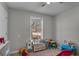 Small bedroom with a window and toys at 4804 Mceachern Way, Powder Springs, GA 30127