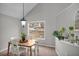 Bright dining area features a wood table with seating for four and a large window at 4804 Mceachern Way, Powder Springs, GA 30127