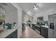 Modern kitchen featuring stainless appliances, white cabinets, and marble countertops at 4804 Mceachern Way, Powder Springs, GA 30127