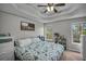 Spacious main bedroom with a tray ceiling, natural light, and comfortable king size bed at 4804 Mceachern Way, Powder Springs, GA 30127