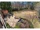 Aerial view of a backyard featuring a patio with dining, outdoor lounge and water feature at 9070 Waits Ferry Xing, Johns Creek, GA 30097