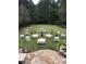 Backyard venue for an outdoor event, with bistro tables and garden patio at 9070 Waits Ferry Xing, Johns Creek, GA 30097