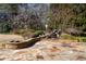 Flagstone patio with a built-in fire pit and a raised planter with small waterfall feature at 9070 Waits Ferry Xing, Johns Creek, GA 30097