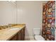 Bathroom with granite countertop, a toilet and an eye-catching multicolored shower curtain at 9070 Waits Ferry Xing, Johns Creek, GA 30097