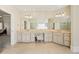 Bright bathroom with double vanities and a convenient makeup station at 9070 Waits Ferry Xing, Johns Creek, GA 30097